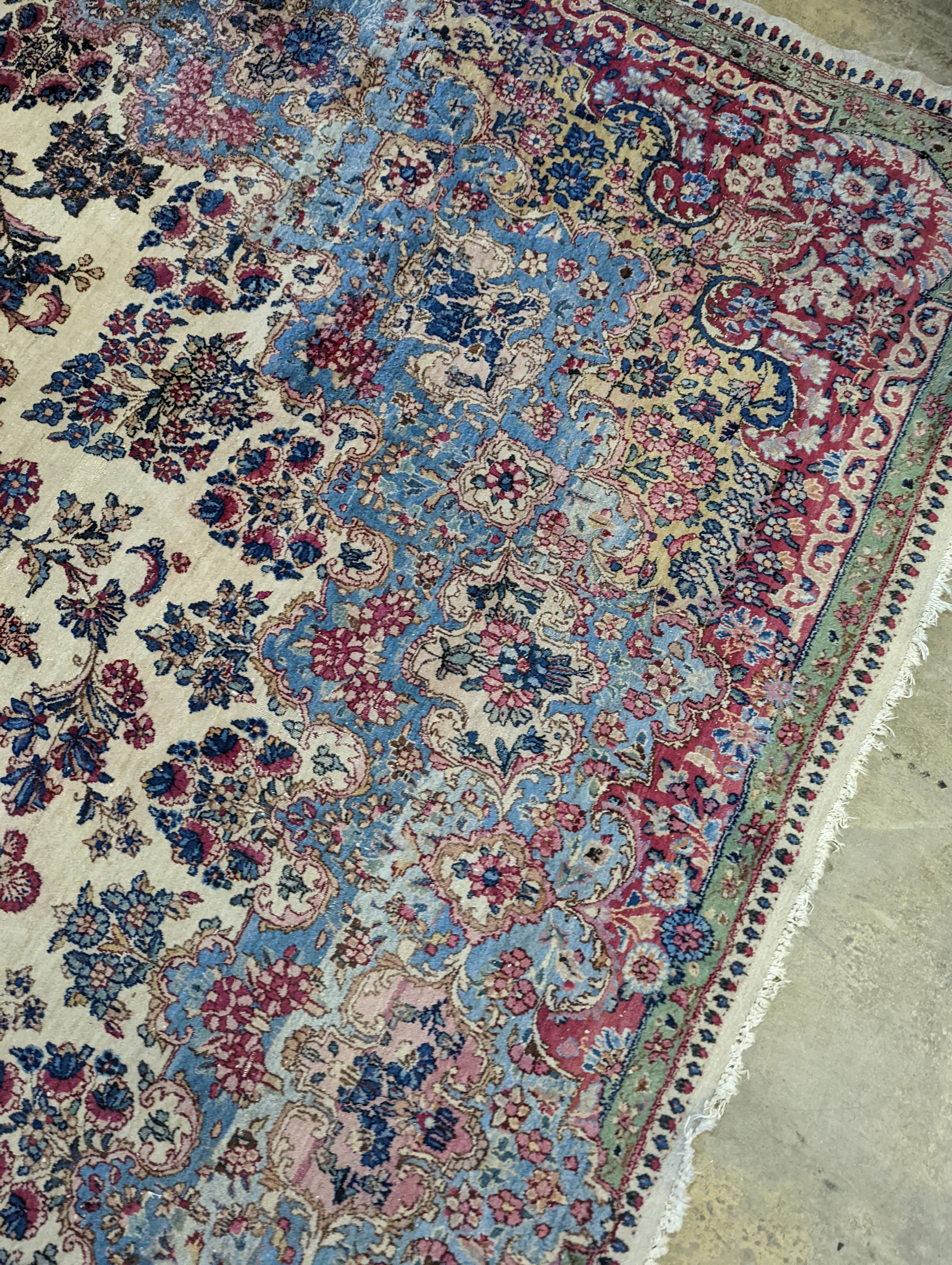 A North West Persian ivory ground carpet, 396 x 290cm